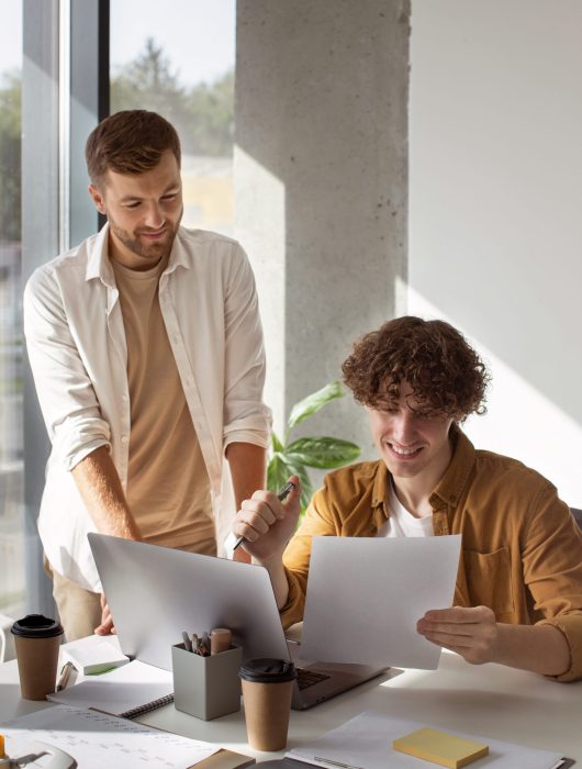 front-view-people-working-with-laptop