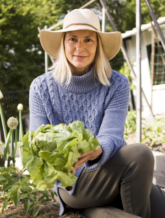 front-view-woman-holding-green-cabbage